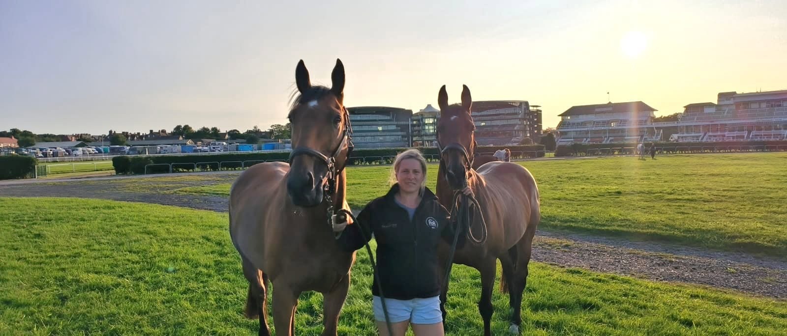 Aimée Cayless with thoroughbreds in the Warwickshire countryside